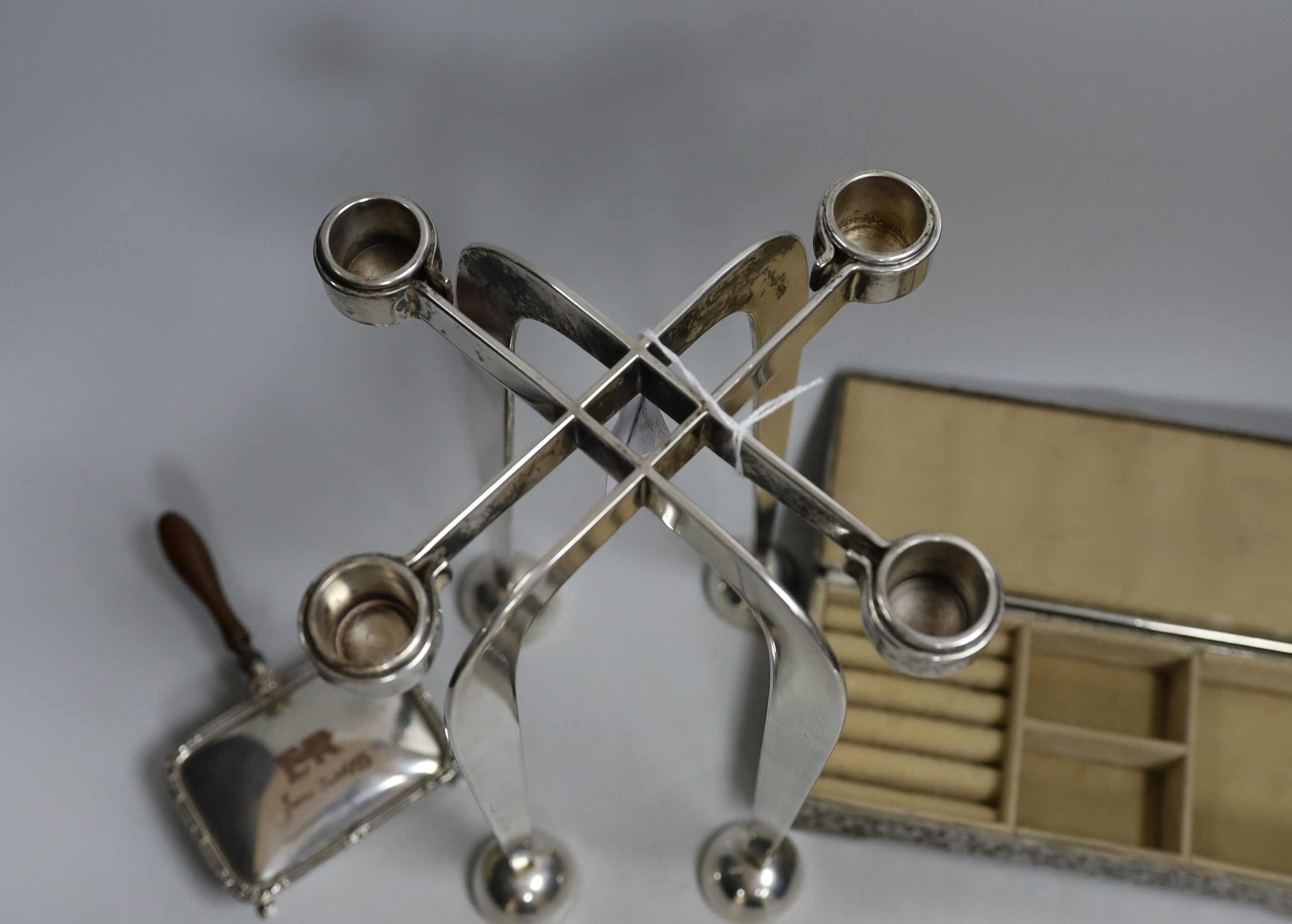 A silver-plated four sconce candelabrum, 28cms high and two other plated items